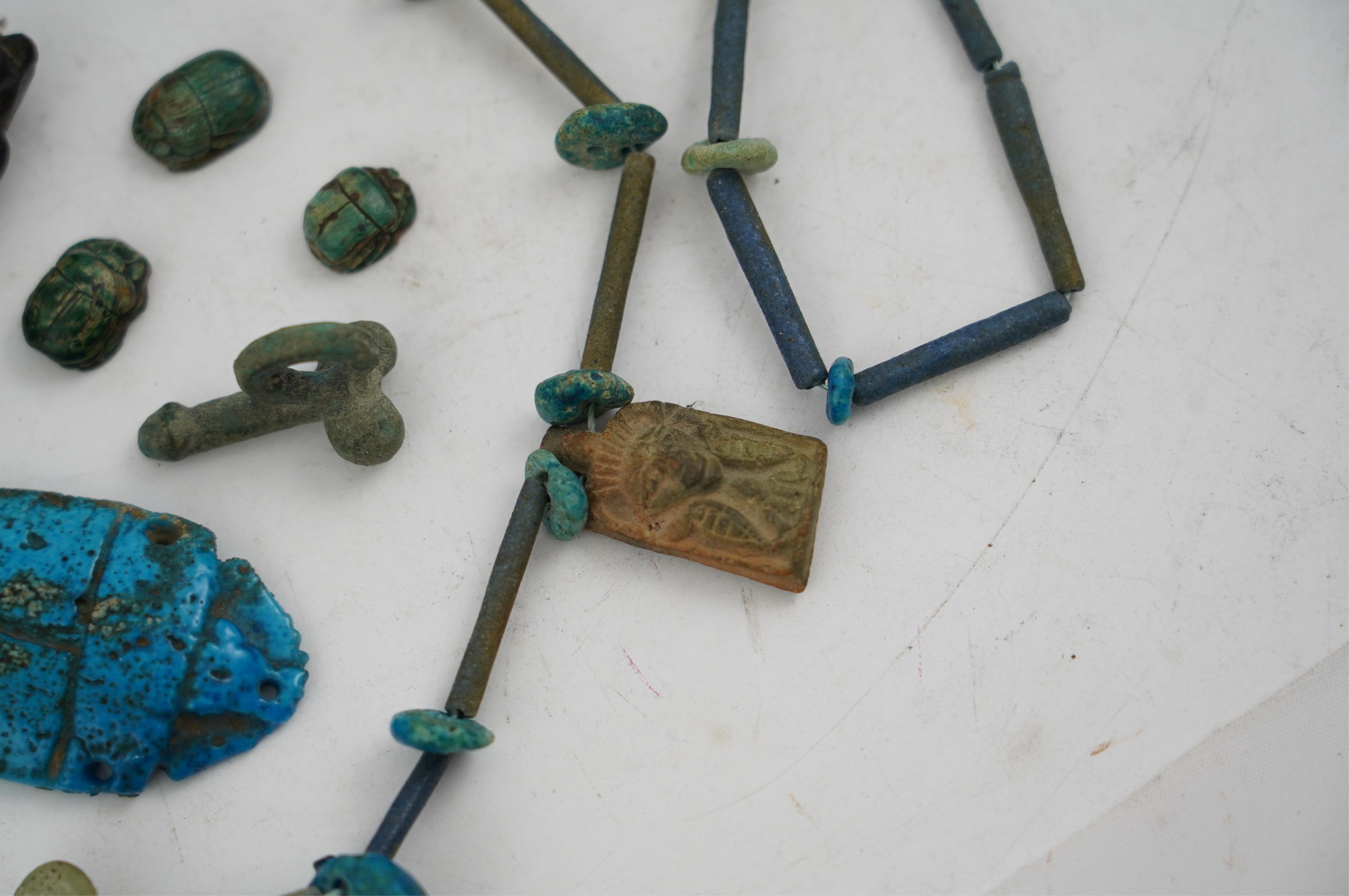 An ancient Egyptian faience necklace, amulets and scarabs, late Kingdom to Ptolemaic period